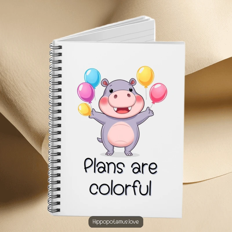 Funny hippo notebook featuring a cheerful hippopotamus juggling colorful water balloons, perfect for journaling.